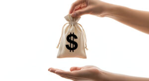 Hand holding money bag with dollar sign isolated on white background